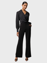 Black viscose stretch pants with embellishments by Marcela Pearl, combining style and comfort.
