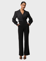 Black stretch shirt from Marcela Pearl, adorned with embellishments for a chic and modern appearance.