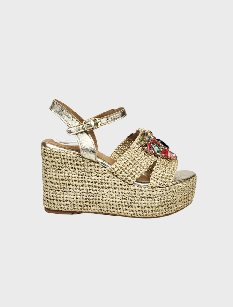 A pair of gold wedge sandals for women featuring a delicate floral design.