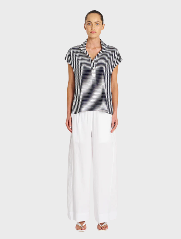 Casual Henley tank in marine blue and white stripes, featuring a classic neckline and sleeveless design.