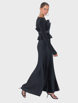 Black masquerade gown featuring long sleeves, high neckline, and intricate pleats for a sophisticated look.