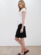 Stylish white matte jersey traveller shell, offering a smooth texture and relaxed fit for various occasions.
