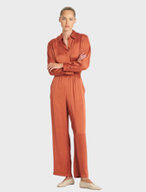 Copper-colored Maxi Pace Pant displayed on a white background, showcasing its sleek design and fabric texture.