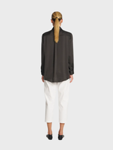 Close-up of a soft mink shirt, emphasizing its luxurious texture and subtle color.
