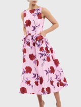 The Melora Midi Dress showcases a lilac vintage rose print, boat neckline, fitted bodice, and a graceful circular midi skirt.