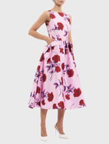 Lilac vintage rose Melora Midi Dress with a boat neckline, fitted bodice, drop waist bows, and a flowing circular skirt.