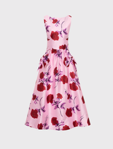 Melora Midi Dress in lilac vintage rose features a boat neckline, fitted bodice, drop waist with bows, and a circular midi skirt.