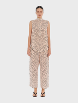 A model displays a pink polka dot print top and matching pants, featuring the Tab Slide Tank in Meringue/Black.