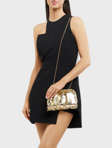 Metallic clutch bag made of shiny gold fabric, offering a sophisticated accessory for evening wear or special events.