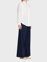 French Navy Microprene Zip Suit Pant, featuring a polished finish and high stretch for casual or formal wear.
