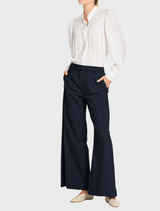 Microprene Zip Suit Pant in French Navy, made from lightweight, stretchy cotton-rich fabric for versatile styling.