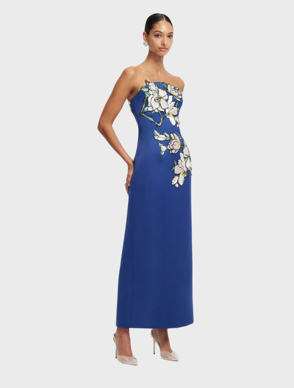 Elegant midnight maxi dress with a floral appliqué bustier design, showcasing a graceful and flowing style.