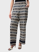Stylish midnight blue pants featuring a vibrant multi-colored pattern, perfect for casual or semi-formal wear.