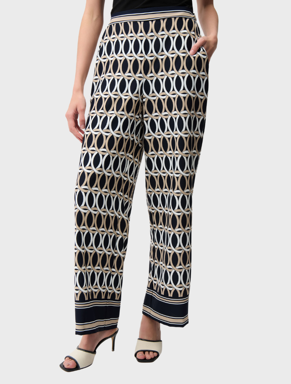 Stylish midnight blue pants featuring a vibrant multi-colored pattern, perfect for casual or semi-formal wear.