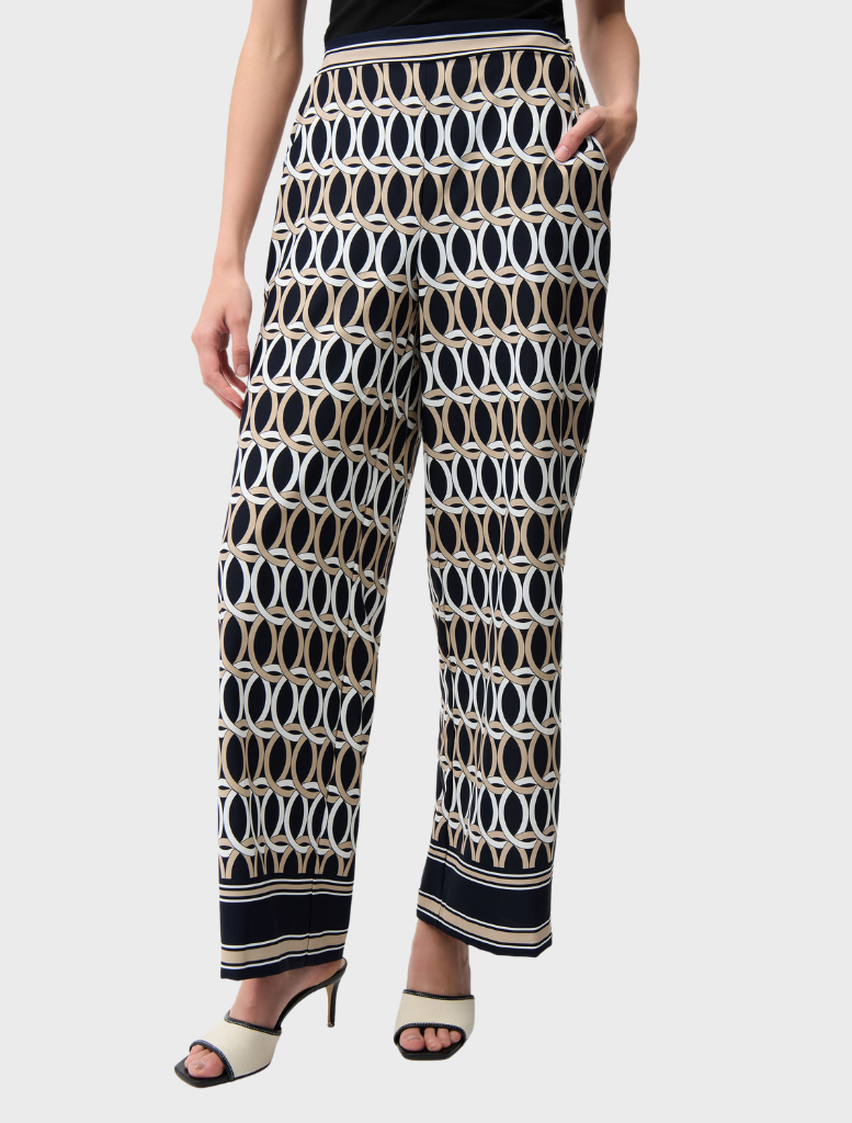 Stylish midnight blue pants featuring a vibrant multi-colored pattern, perfect for casual or semi-formal wear.