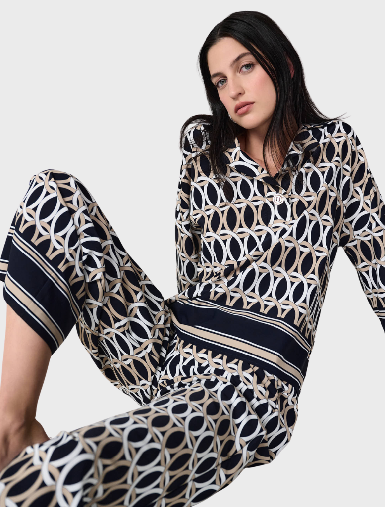 Top in midnight blue with multi-colored accents, featuring a stylish design suitable for various occasions.