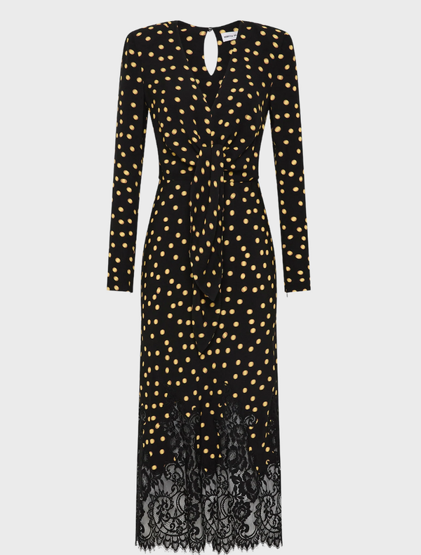 A black dress adorned with gold polka dots and finished with elegant lace trim.