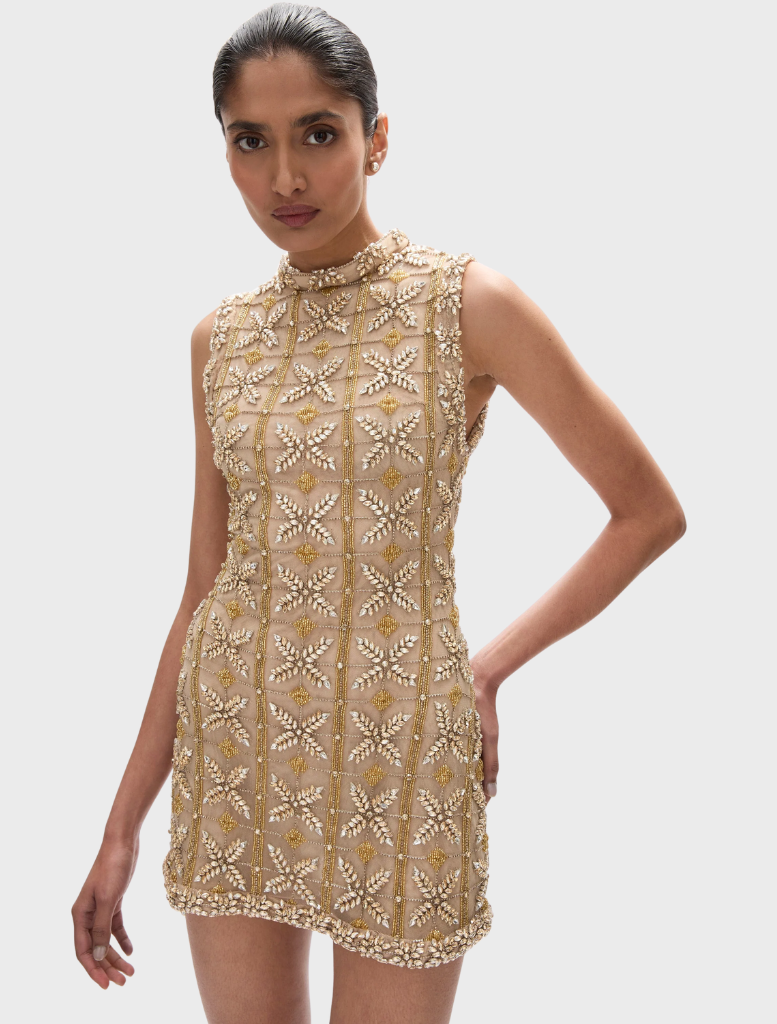 Iris Mini with a metallic sheen, highlighting its elegant design and small form factor for versatile applications.