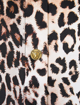Elegant mini shirt dress adorned with feathers, showcasing a flamenco fan print and a flowing silhouette.