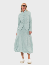 Mint poplin skirt featuring a vibrant print, showcasing a stylish and modern design suitable for various occasions.