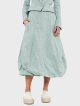 Elegant mint poplin skirt featuring a unique print, designed for versatility and style in everyday wear.
