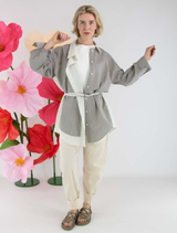Grey Mira blouse displayed on a hanger, showcasing its elegant design and fabric texture.