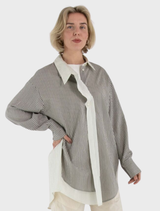 Grey Mira blouse displayed on a hanger, showcasing its elegant design and fabric texture.