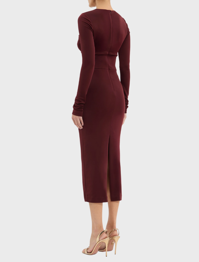 Stretchy burgundy dress with long sleeves, complemented by a chic gold chain accessory.