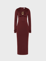 Burgundy long-sleeve dress made of stretchy fabric, featuring a stylish gold chain accent.