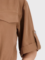 Elegant mocca jacket on a model, highlighting ¾ sleeves, cuffed details, and a lightweight modal blend fabric.