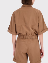 Elegant mocca jacket displayed on a model, highlighting its lightweight fabric, ¾ sleeves, and refined design details.