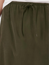  Elegant olive modal skirt with a straight cut, adjustable waist, side slit, and no visible fastenings for a minimalist look.