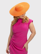 Stylish orange racewear hat with a minimalist aesthetic, designed for a secure fit and versatile hair styling options.
