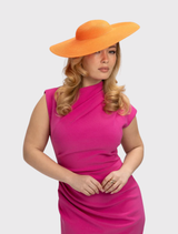 Orange structured racewear hat with a minimalist design and fitted headband for secure, stylish wear on race day.