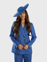 Modern royal blue racewear hat featuring a sculptural shape and fitted headband for comfort and effortless styling.