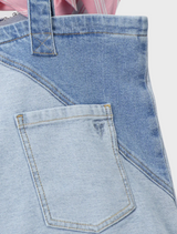 A collage of denim fabric swatches, displaying various shades of blue and the characteristic weave of denim.