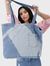 A visual representation of denim fabric, focusing on its blue tones and the distinctive texture of the material.