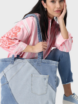 An image featuring a variety of denim textures, emphasizing the deep blue shades and intricate stitching details.