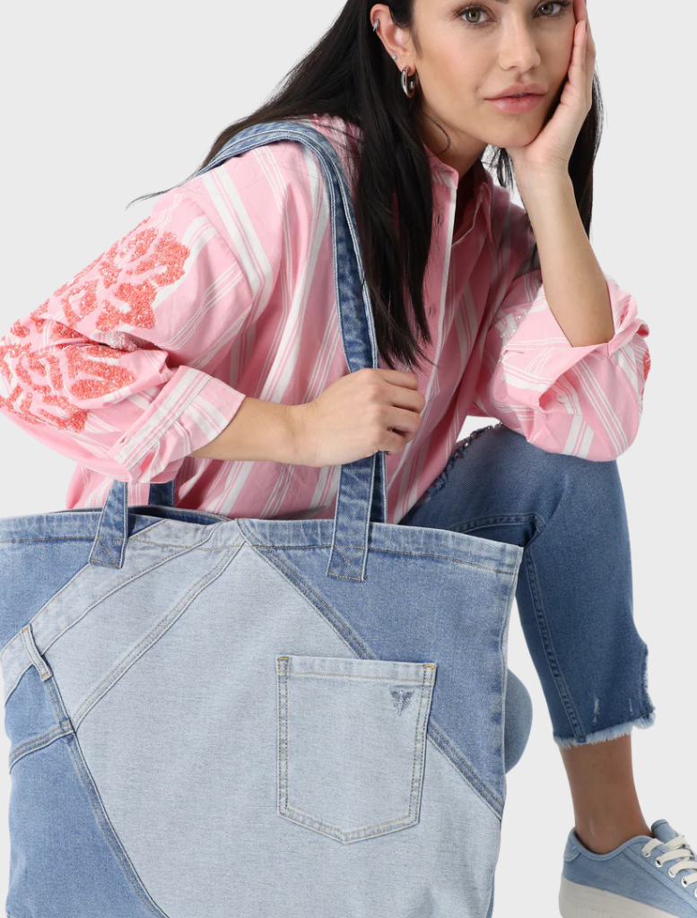 An image featuring a variety of denim textures, emphasizing the deep blue shades and intricate stitching details.