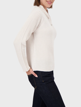 Monari ribbed sweater in a soft almond hue, designed for comfort and versatility in everyday fashion.