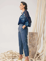 Cropped leather straight leg pants in stonewashed blue, showcasing a stylish and modern design for versatile outfits.