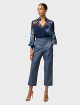 Stylish cropped leather straight leg pants in stonewashed blue, perfect for adding a trendy touch to any wardrobe.