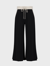 Contemporary black pants featuring moonstone accents, designed for comfort and style in any wardrobe.
