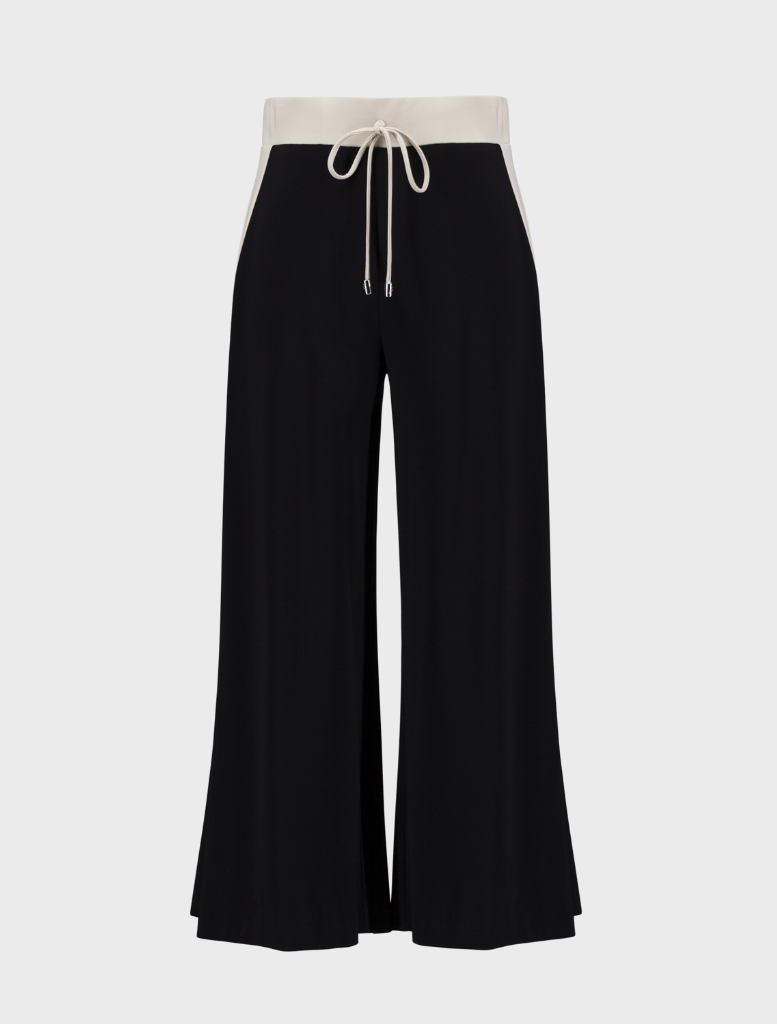 Contemporary black pants featuring moonstone accents, designed for comfort and style in any wardrobe.