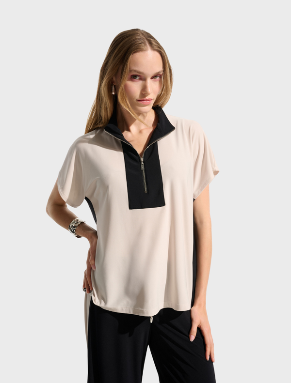 Stylish top in moonstone and black, highlighting a contemporary and elegant aesthetic.