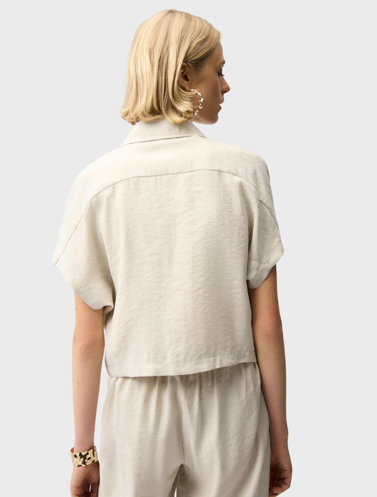 Zipper front jacket in a soft moonstone hue, combining fashion and functionality for everyday wear.
