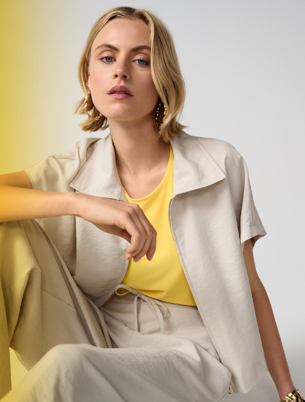 Moonstone zipper front jacket, showcasing a contemporary style with a smooth finish and functional design.