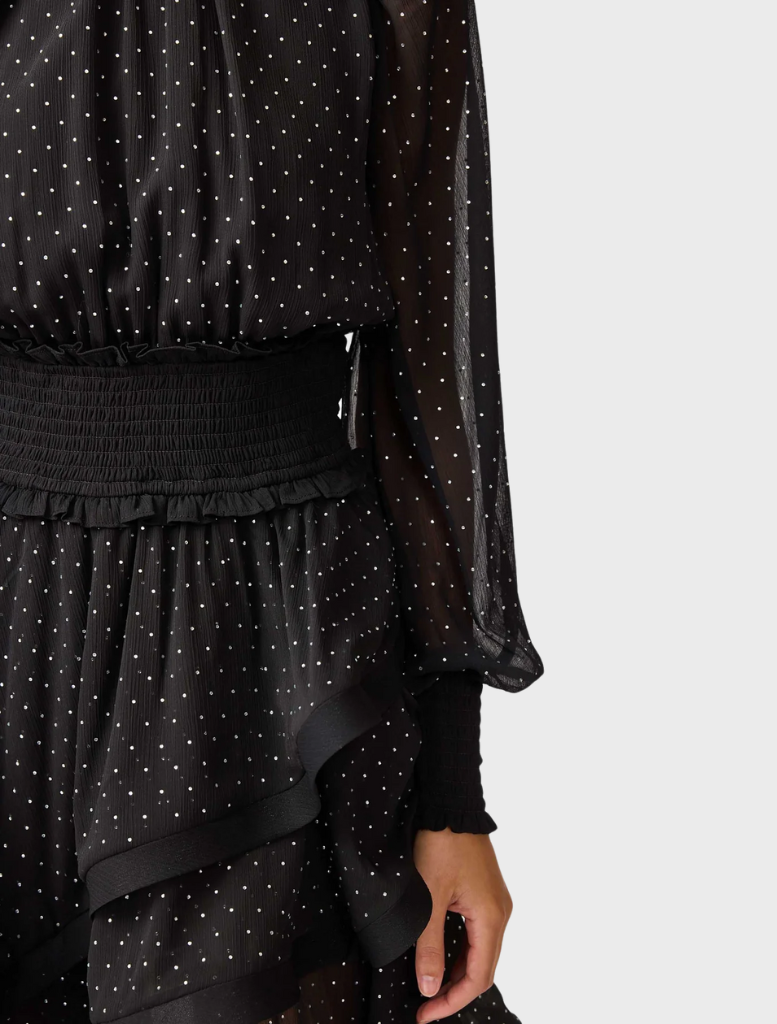 Chic black Moss Mini Dress designed with a modern cut, perfect for dressing up or down for any occasion.