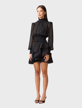 Black Moss Mini Dress showcasing a contemporary style with a flattering fit, suitable for day or evening wear.