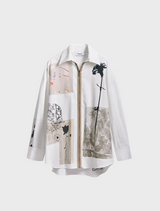 The model displays a white shirt adorned with an abstract pattern, emphasizing modern artistic style in clothing.